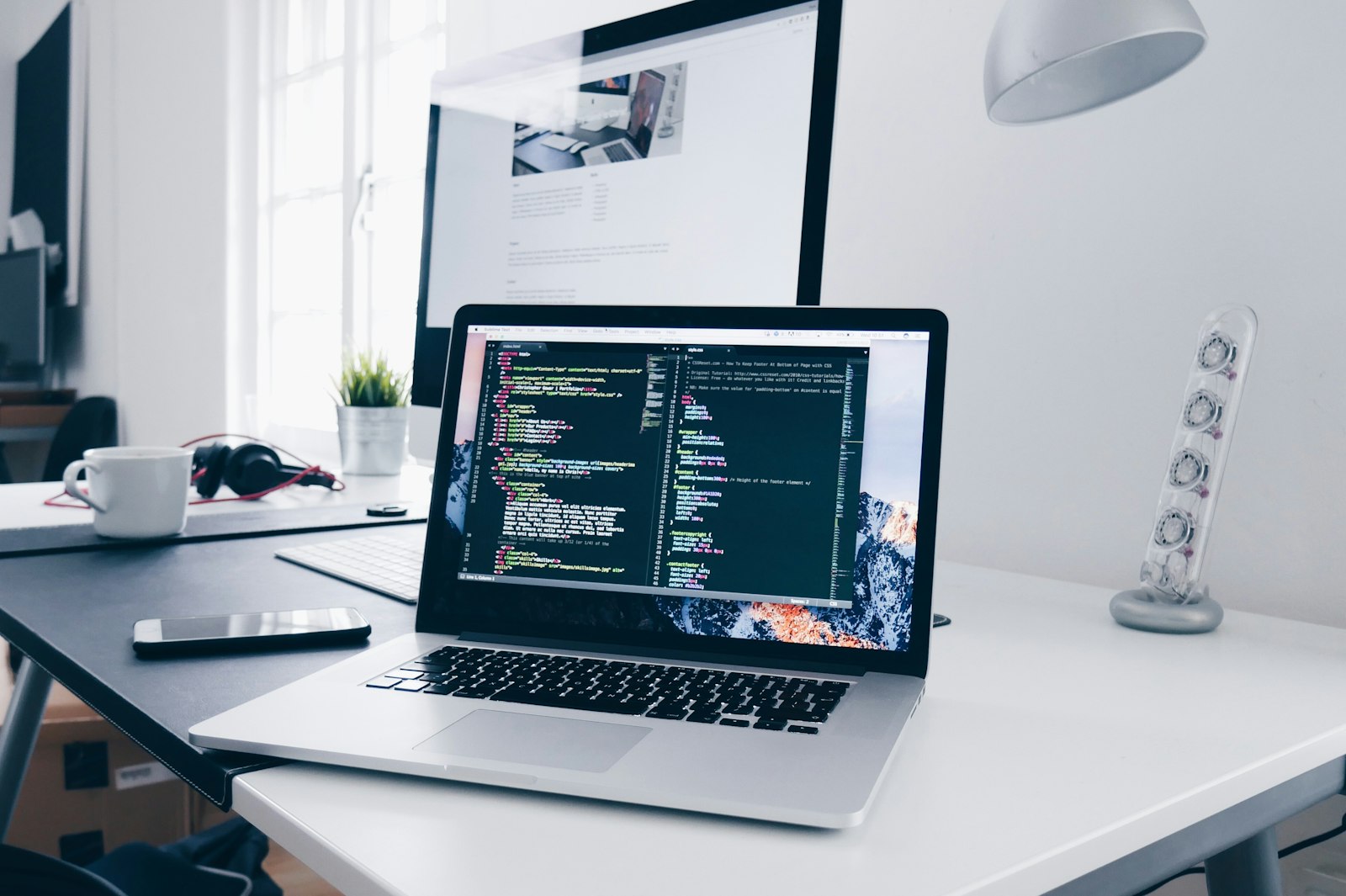 Developer working with AI tools showing code on a screen